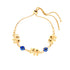 The Blue Evil Eye and Elephant Charms Bracelet, crafted with 14k gold-filled material, features an adjustable chain adorned with three elephant charms and two blue beads reminiscent of an evil eye design, all evenly distributed along the band.